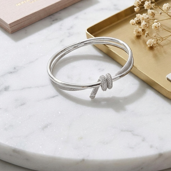 Ellie- Cubic Zirconia Pave Knot Accent Hinged Bangle Bracele