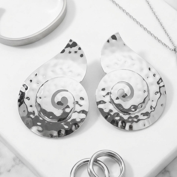 Rasha  - Hammered Metal Spiral Statement Clip On Earrings
